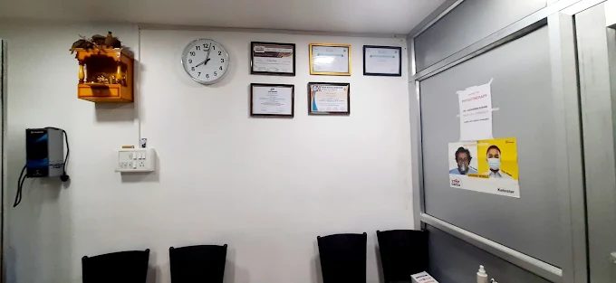 Doctor's certifications displayed on the wall
